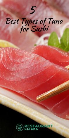 sushi on a plate with chopsticks and garnish