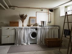 a washer and dryer in a small room