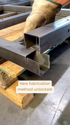 a man working on metal beams in a factory with the words new installation method unlocked