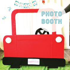 a child's photo booth made out of cardboard with the word happy on it