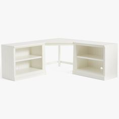 a white corner desk with shelves on each side