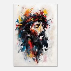 the face of jesus painted with colorful paint splattered on white paper and framed in wood frame