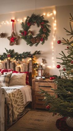 a bedroom decorated for christmas with lights and wreaths