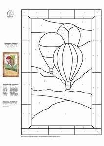 a stained glass window with a hot air balloon in the sky on it's side