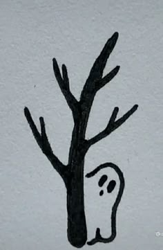 a black and white drawing of a tree with a ghost drawn on it's trunk