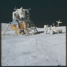 an astronaut's vehicle parked on the moon next to another vehicle