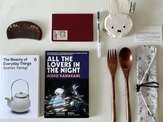 an assortment of items from the book all the lovers in the night by mario kakkamami