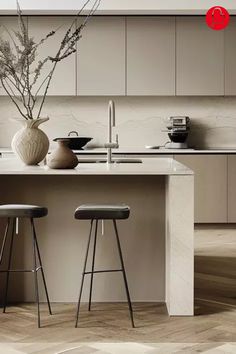 two stools in front of a kitchen island