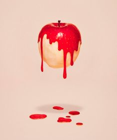 an apple is dripping with blood on it