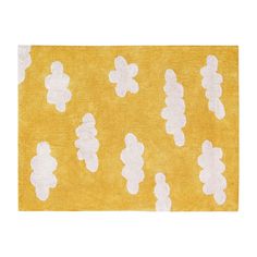 a yellow rug with white teddy bears on it