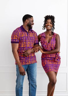 Style# M2080PTA Introducing the Femi Men's African Print Polo in Purple Tangerine Adire. This vibrant short-sleeved design features an African-inspired pattern in a range of bold colors, perfect for standing out in any outfit. Dress it up with slacks or dress it down with sneakers and jeans for casual settings. Shop matching items here. Description Short Sleeve Polo Vents at Sides 95% Cotton/5% Spandex body with 100% Cotton rib knit Designed in the US, imported Care Instructions Machine wash col Purple Fitted Cotton Shirt, Purple Fitted Short Sleeve Top, Fitted Purple Cotton T-shirt, Fitted Purple Collared Shirt, Fitted Multicolor Collared T-shirt, Fitted Collared Multicolor T-shirt, Multicolor Fitted Collared T-shirt, Sneakers And Jeans, Polo Outfit