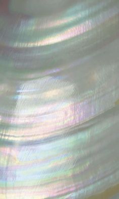 a close up view of an iridescent background