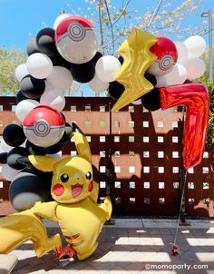 some balloons are in the shape of pikachu and other pokemon characters