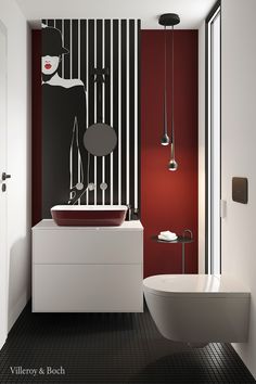 a modern bathroom with red and black walls