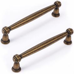 pair of antique brass door handles on white background