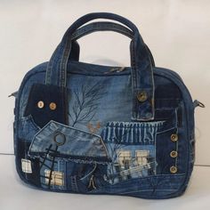 a handbag made out of old jeans with houses and trees on the front pocket