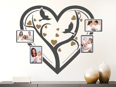 a heart shaped wall decal with pictures of people and birds in the shape of a tree