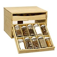 a wooden box filled with lots of different types of spices