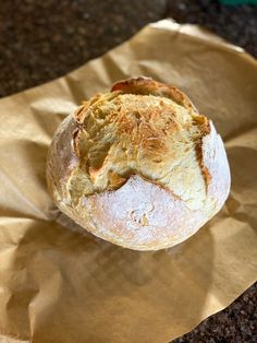 a loaf of bread sitting on top of a piece of paper