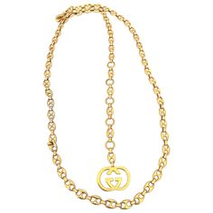 Gucci 1970's Gold Tone Mariner Link Chain Belt Size: 38 - 42 Length: 44.5" Width of pendant: 1.5" x 1" Classic Gold Chain Necklace With Logo Charm, Formal Gold Chain Necklace With Logo Charm, Gold-tone Necklace With Logo Charm For Formal Events, Gold-tone Chain Link Jewelry With Logo Charm, Gold-tone Metal Chain Necklace With Logo Charm, Formal Gold-tone Necklace With Logo Charm, Designer Pendant Chain Jewelry, Vintage Necklace With Logo Charm For Formal Occasions, Designer Yellow Gold Metal Necklaces