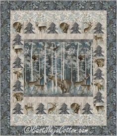 a quilted wall hanging with animals in the woods and trees on it's sides