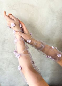 These ethereal tulle bridal gloves are more than just accessories--they're a declaration of style and sophistication. Crafted from delicate tulle in soft romantic lilac hues, the Claramay fingerless bridal tulle gloves add a dash of whimsy and romance to your bridal ensemble. * DETAILS * > Designed and handmade in Australia. Worldwide shipping > Soft bridal tulle, fabric flowers, hand beading > Measurement: One size, custom sizes available > Made to order: Production times in tabs below * MADE T Wedding Gloves Fingerless, Dystopian Wedding, Lilac Gloves, Butterfly Gloves, Fairy Gloves, Purple Theme Wedding, Aesthetic Gloves, 30s Aesthetic, Flower Gloves