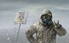 a man wearing a gas mask standing next to a sign