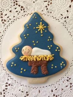 a decorated cookie with a baby in a manger