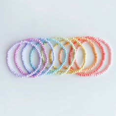 Brighten up a bare wrist or already bustling arm party with these candy colored seed bead stacking bracelets! Treat yo' self or your best friend to a cute, colorful beaded bracelet with any initials, names, or words! Length and text fully customizable upon request. Standard lengths are 7" for women, 8" for men, 5.5" for kids. **Please double check all personalization details and requests. All bracelets are custom made to order and all sales are final. **Treat jewelry with care and avoid exposure Adjustable Pastel Beaded Bracelet, Trendy Beaded Pastel Bracelets, Adjustable Pastel Bracelets With Round Beads, Casual Rainbow Friendship Bracelets With Tiny Beads, Pastel Beaded Bracelets For Everyday, Casual Rainbow Beaded Bracelets With Tiny Beads, Trendy Adjustable Pastel Beaded Bracelets, Adjustable Pastel Beaded Bracelets For Friendship, Adjustable Pastel Beaded Bracelets For Everyday