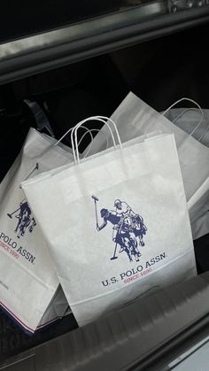 several bags with the u s polo logo on them