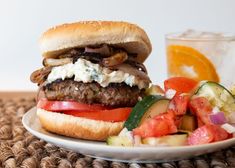 a plate with a burger and salad on it