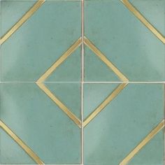 a green tile with gold lines on the edges and bottom, as well as an image of a diamond