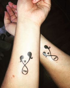 two people with matching tattoos on their arms