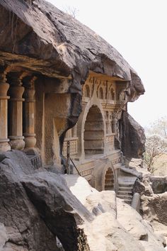 an old building built into the side of a cliff