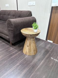 a living room with a couch, chair and coffee table in front of the couch