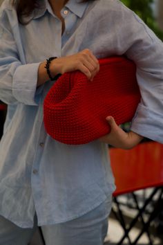 Trendy dumpling clutch in bright red Step out in style and confidence with this handcrafted red crochet bag, designed for women who aren't afraid to stand out. This isn't just a bag--it's a statement, a showstopper that adds a fierce touch to any outfit. Material: Crafted from high-quality yarn for durability and a luxurious feel. Color: Red. Size: The clutch measures 36 cm at the base, providing ample space for your essentials. Closure: Secured with a premium-quality kiss lock frame (clasp), ensuring your belongings are safe. Customizable Hardware: If made to order, choose from gold, silver, antique, or dark (black) nickel hardware to suit your style.  Care Instructions: Keep your bag as bold as you are. Spot clean or dry clean only to ensure it remains as vibrant as the day you bought it Red Knitted Bags For Everyday Use, Red Knitted Bag For Everyday Use, Red Knitted Everyday Bags, Handmade Red Crochet Pouch Bag, Red Crochet Bag For Shopping, Daily Use Red Crochet Shoulder Bag, Red Crochet Shopping Bag, Red Crochet Shoulder Bag For Everyday Use, Red Crochet Tote Bag