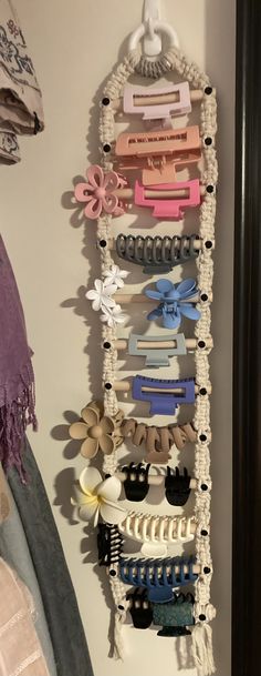 a bunch of hair clips hanging on a wall