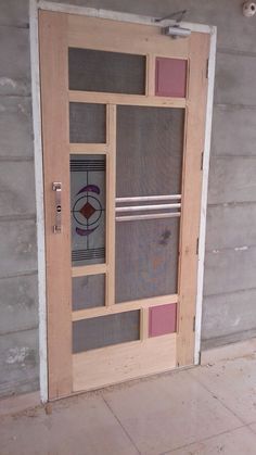 a wooden door with glass panels on it