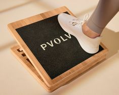 a person standing on top of a wooden box with the word pvolyn written on it