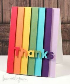 a rainbow colored thank you card with the word thanks written in large letters on it