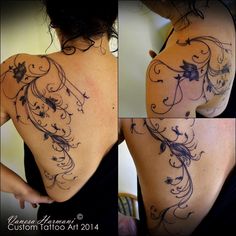 the back of a woman's shoulder with flowers and vines on her left side