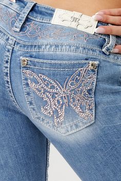 Low-rise, light-wash slim bootcut jeans- Butterfly design in pink and silver embroidery with matching yoke design- Mini silver rhinestone rivets throughout design- White leather logo brand patch- Rhinestone rivets- 5-pocket design- Slight fading Model is wearing size: 26Model Measurements:Height: 5'8"Bust: 35"Waist: 26"Hips: 39" Fabric Content: 52% Cotton, 27% Lyocell, 20% Polyester, 1% Elastane Care: Gentle machine wash inside-out with like colors in cold water. Tumble dry low. Style No. L9330S Luxury Faded Denim Flare Jeans, Cheap Vintage Cutoff Jeans, Star Boot Cut Jeans, Flare Jeans Print, Cheap Fitted Light Wash Flare Jeans, Luxury Faded Flare Jeans, Luxury Women's Jeans With Flap Pockets, Western Cute Jeans, Luxury Blue Flare Jeans