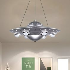 a large light fixture hanging from the ceiling in a living room