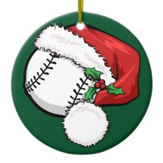 a baseball ornament with a santa hat on it