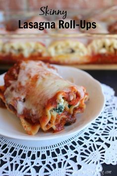 a white plate topped with lasagna roll ups