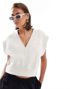 Top by Nike Introduce it to your other nice tops V-neck Sleeveless style Nike branding Regular fit Trendy White V-neck Tank Top, White V-neck Vest Top, Trendy V-neck Sports Top, Casual V-neck Workout Tops, Casual White V-neck Tank Top, White Casual V-neck Tank Top, Spring Athleisure V-neck Tank Top, Spring V-neck Athleisure Tank Top, White V-neck Athleisure Top