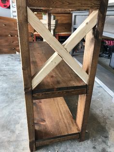 a wooden shelf sitting on top of a floor