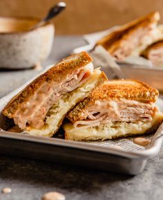 a sandwich cut in half sitting on top of a plate