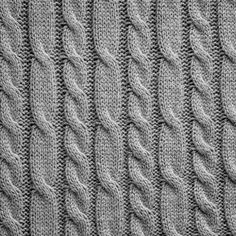 the texture of knitted fabric in grey tones, closeup view - stock photo