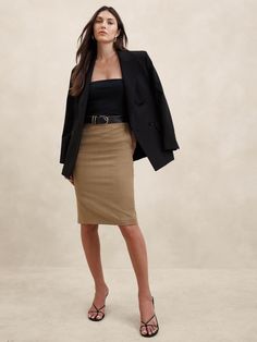 Indulgent and elegant, this expertly tailored pencil skirt elevates any wardrobe with a luxurious wool fabrication and a darted waist to accentuate in stunning proportions.  PENCIL SKIRT FIT: High rise, fitted from hip to hem.  RESPONSIBLE WOOL STANDARD CERTIFIED (Control Union Certifications CU 862581): This global standard protects the sheep that supply the wool for this sweater as well as the land they graze, working to make it better for the environment and the sheep.  Certified by NSF Certification, LLC C0517446 FROM ITALY'S MARZOTTO MILL: This style is crafted using 100% virgin wool from Italy's Marzotto mill - one of the oldest mills in Italy, renowned for creating innovative fabrics from the world's most luxurious fibers.  Hidden zip with hook-and-eye closure at wearer's left side. Outfit Pencil Skirt, Court Outfit, Conference Outfit, Wool Pencil Skirt, The Sheep, Skirt Fits, Bottom Clothes, Siena, Stunning Dresses